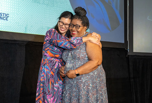 NDWA President Ai-jen Poo congratulates Barbara Young on her Lifetime Achievement Award