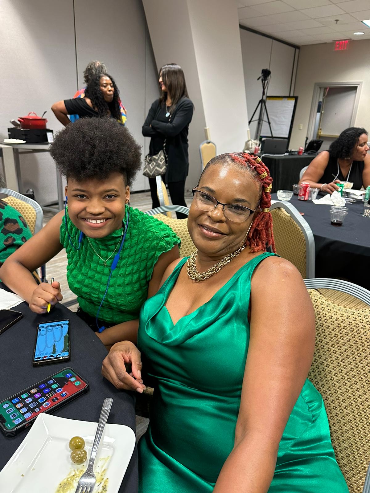 Two women smiling for the camera.